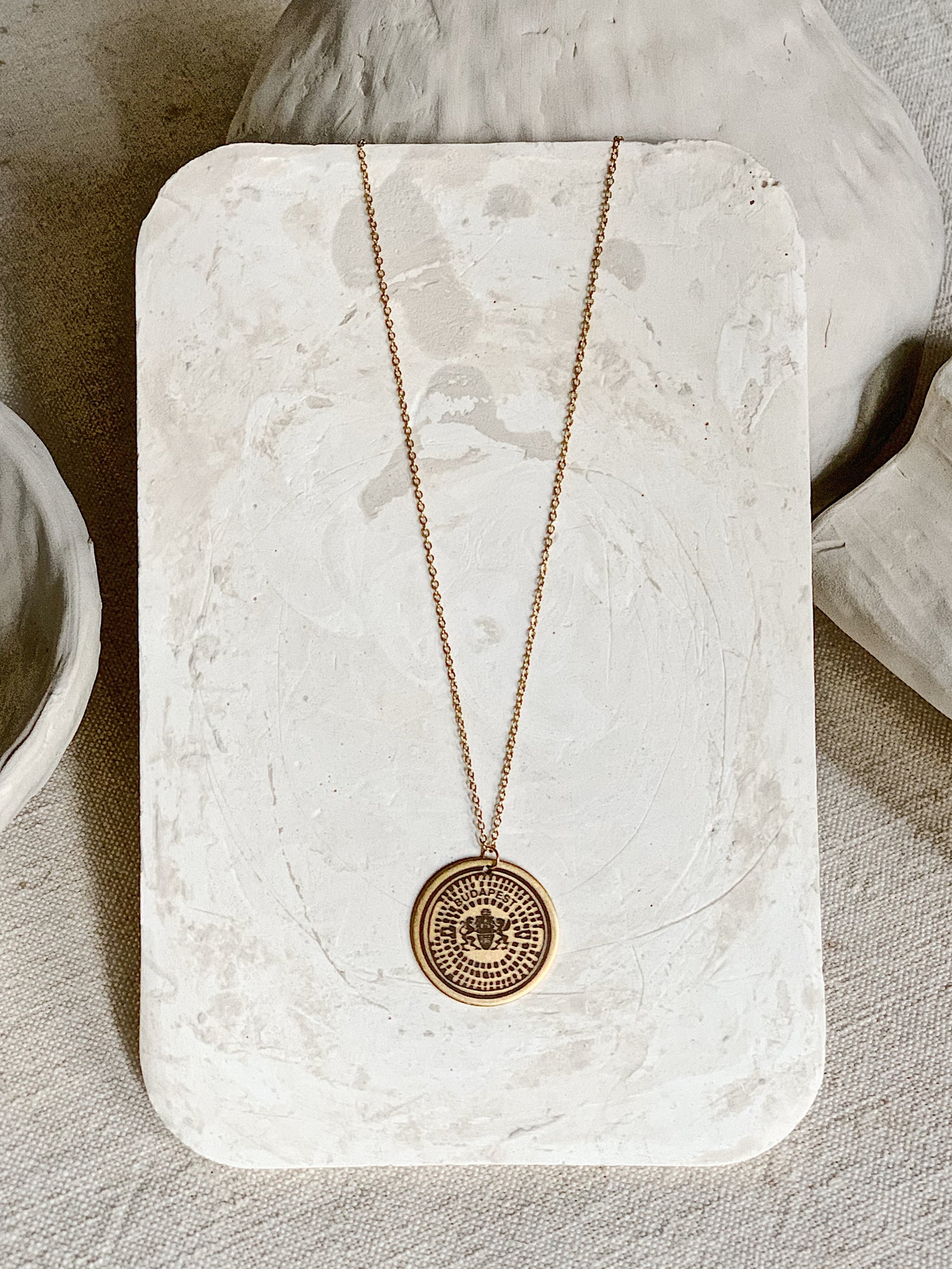 BP manhole cover necklace