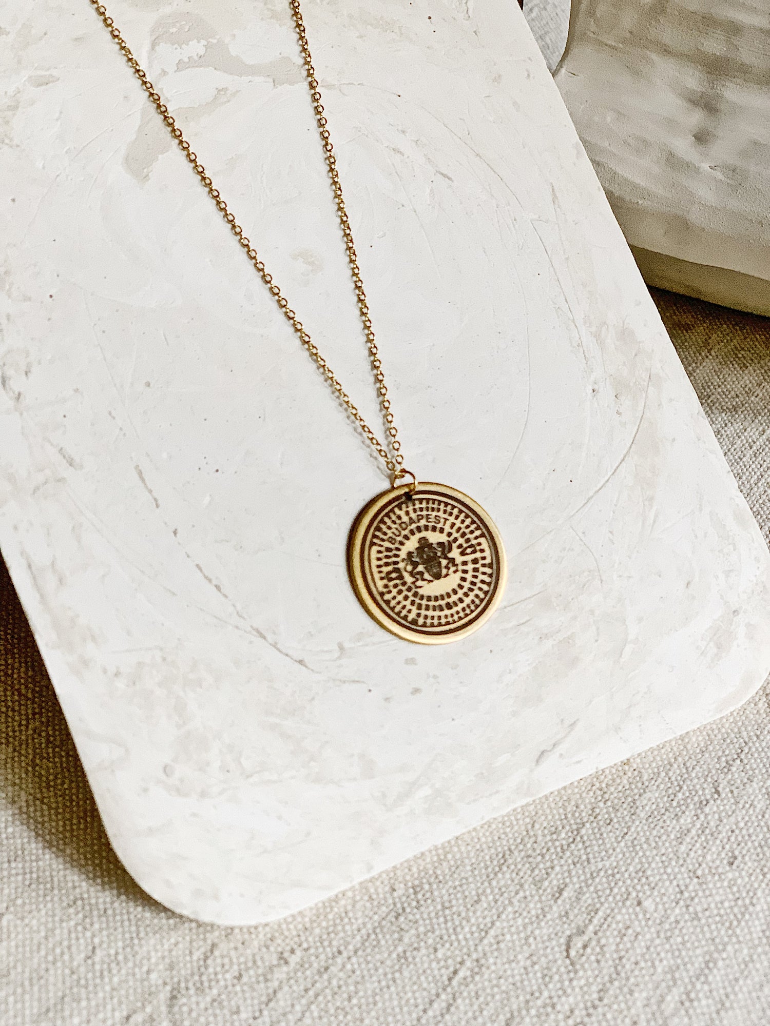 BP manhole cover necklace