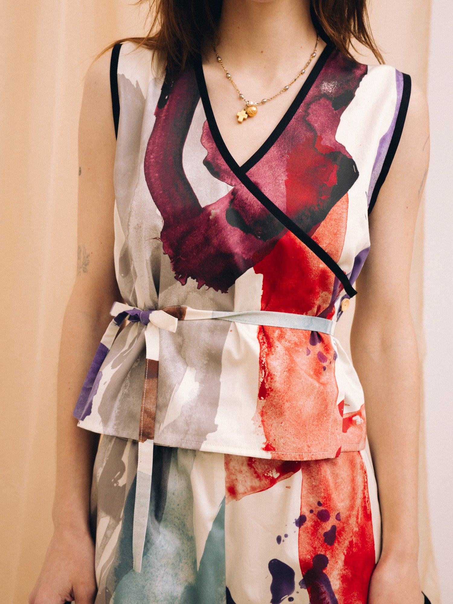 Symbols overlapping women's top