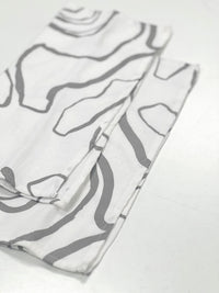 White vintage napkin with Journey pattern