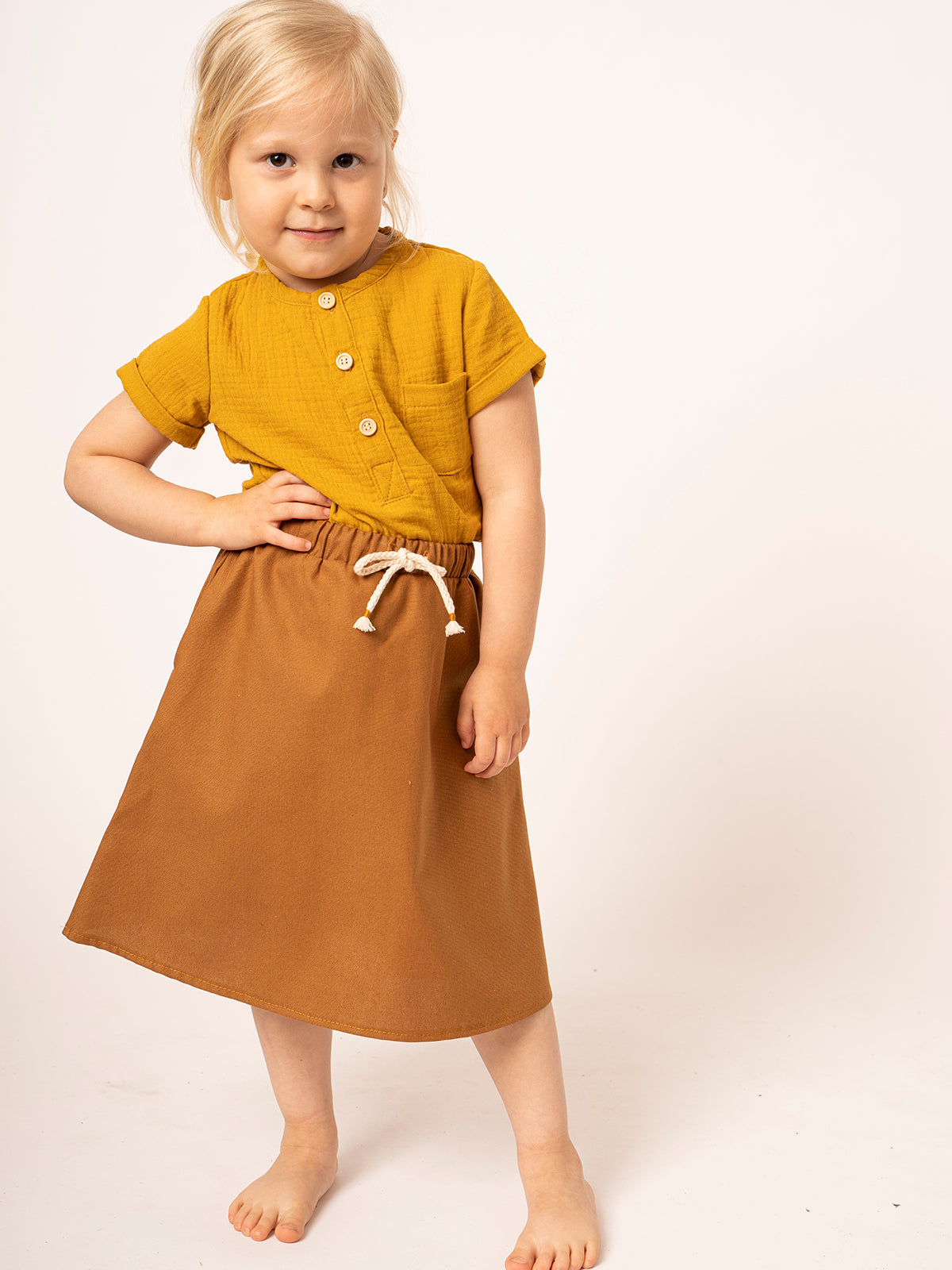 Girl's skirt in mustard-colored cotton canvas