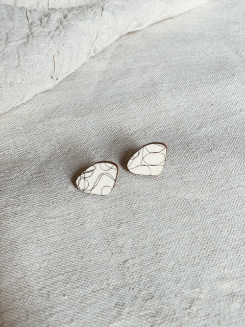 Medium amoeba wood earrings with doodle pattern