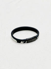 Black leather bracelet with a small wave pattern