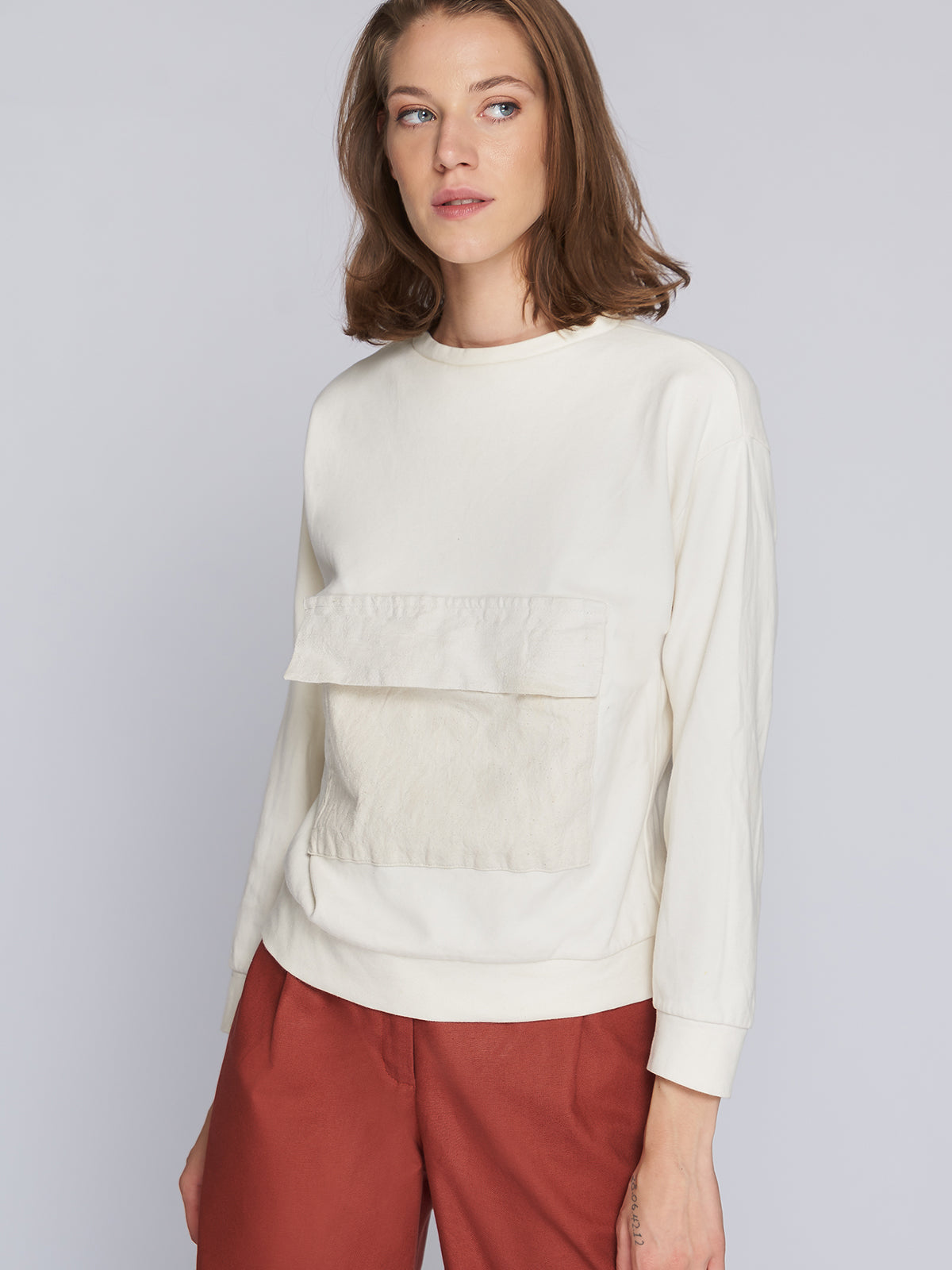 Natural women's sweater with large pockets